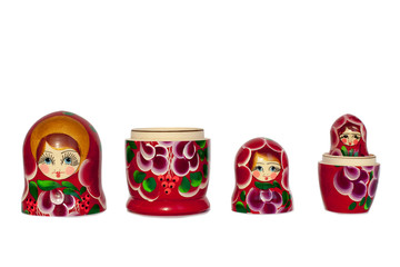 Matryoshka Russian souvenir bright red on white background isolated closeup