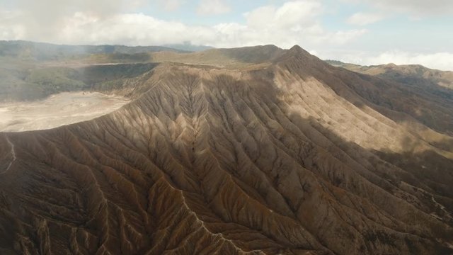 Volcano crater in East Jawa, Indonesia. Aerial view of volcano crater Mount Gunung Bromo is an active volcano,Tengger Semeru National Park. 4K video. Aerial footage.