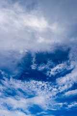 Blue sky with white and blue and pink clouds. Clear sky. Beautiful sky. Evening sky. Yellow and blue cloud in the sky.