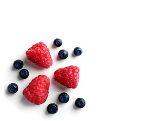 Delicious ripe berries on white background, top view