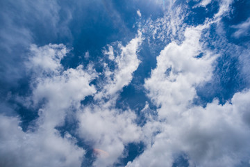 Blue sky with white and blue and pink clouds. Clear sky. Beautiful sky. Evening sky. Yellow and blue cloud in the sky.