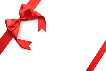 Red ribbons with bow on white background