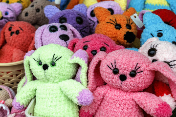 Knitted handmade dolls for sale in the street shop of souvenirs. Close-up