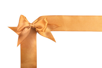 Fototapeta premium Golden ribbons with beautiful bow on white background