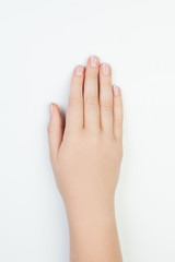 Manicure concept. Beautiful female hand on white background
