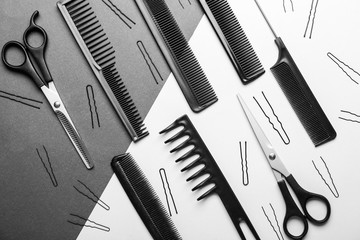 Professional hairdresser's set on color background