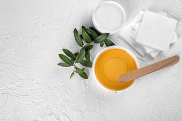 Set for epilation on white textured background