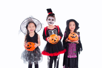 Group of asian children wearing halloween costume standing over white background