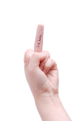 A bandage on middle finger with hand writing "Life hurts".