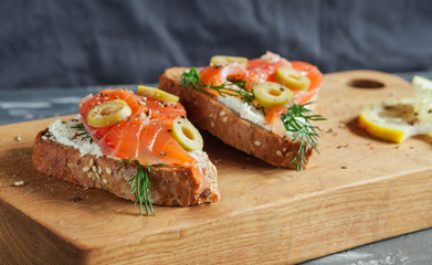 Sandwiches with trout and olives