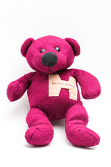 Sometimes love hurts. A band aid on bear's chest with hand writing.