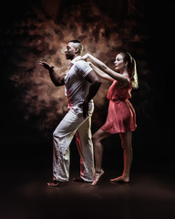 Young and sexy couple dances Caribbean Salsa