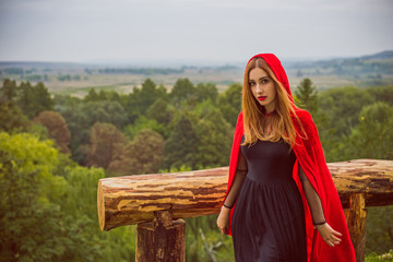 Halloween concept, glamorous costume detail. Young beautiful and mysterious woman in woods, in...