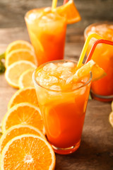 Fresh summer cocktail in glasses on wooden table