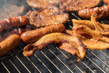 Unhealthy but tasty grilled sausages and meat