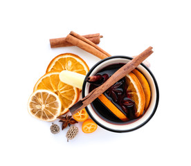 Metal cup of delicious mulled wine on white background