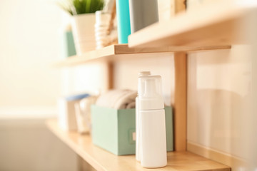 Obraz na płótnie Canvas Body care accessories on shelf in bathroom
