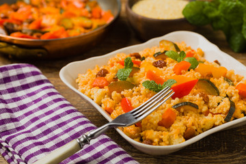 Millet with vegetables and raisins.
