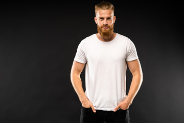 Handsome young guy posing in studio - isolated.