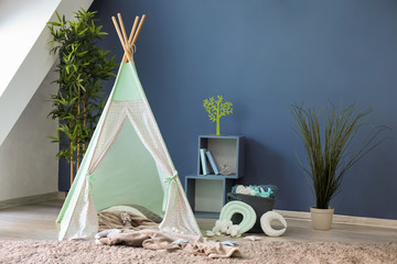 Cozy play tent for kids in interior of room © Pixel-Shot