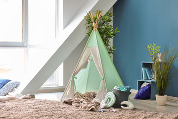 Cozy play tent for kids in interior of room © Pixel-Shot