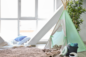 Cozy play tent for kids in interior of room © Pixel-Shot