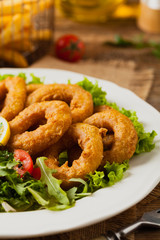 Roasted squid rings with salad.