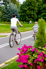 Girl riding a bike in the city Park 