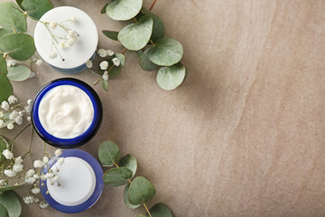 Flat lay composition with body cream on table
