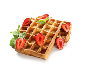 Delicious waffles with strawberries on white background