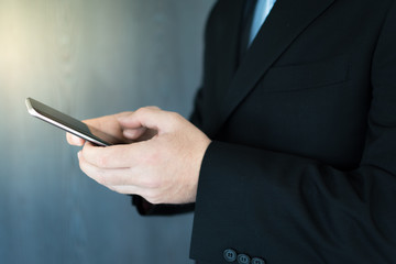 A young executive working on his mobile phone