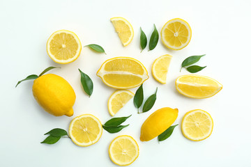 Flat lay composition with ripe juicy lemons on white background