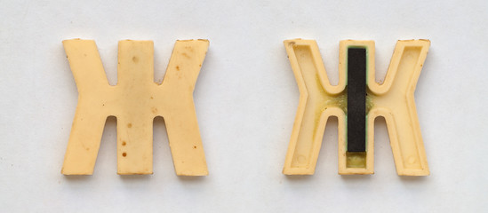 bright plastic cyrillic letters with magnet on white paper