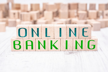 The Words Online Banking Formed By Wooden Blocks On A White Table