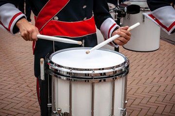 Details from a show and Marchingband or fanfare and drumband with uniforms and Instruments.
