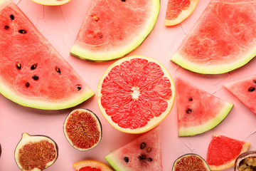 Summer composition with ripe fruits on color background