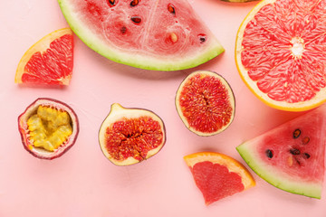 Summer composition with ripe fruits on color background