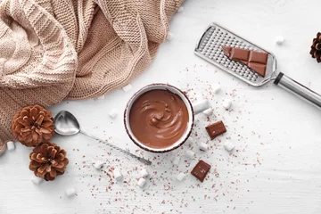 Zelfklevend Fotobehang Cup of hot chocolate on light table © Pixel-Shot