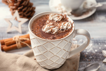 Cup of hot chocolate with marshmallows on table