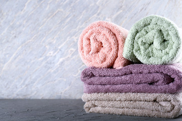 Clean soft towels on grey table