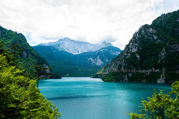 Fototapeta na wymiar landscape of beautiful Piva Lake, mountains and clouds in Montenegro