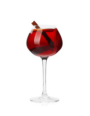 Glass of delicious mulled wine on white background