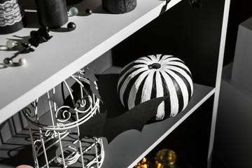 Creative decorations for Halloween party on shelves