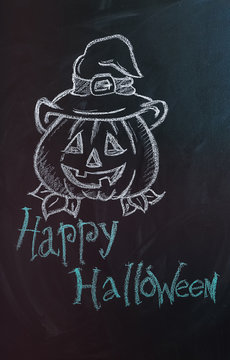 Drawing of pumpkin with text "Happy Halloween" on dark background
