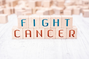 The Words Fight Cancer Formed By Wooden Blocks On A White Table