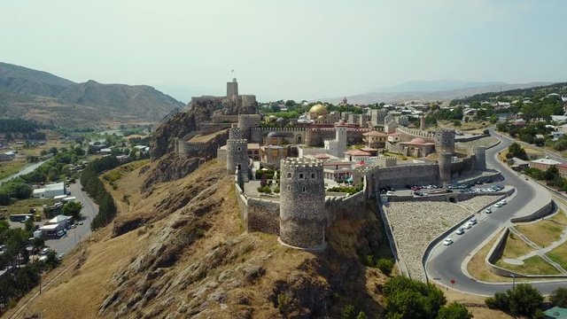 Drone footage of external decoration of Akhaltsikhe fortress Rabati, ancient castle has been completely restored, located on a high hill in the city center, Georgia