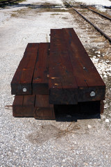 Wooden sleepers in railway station in stock.