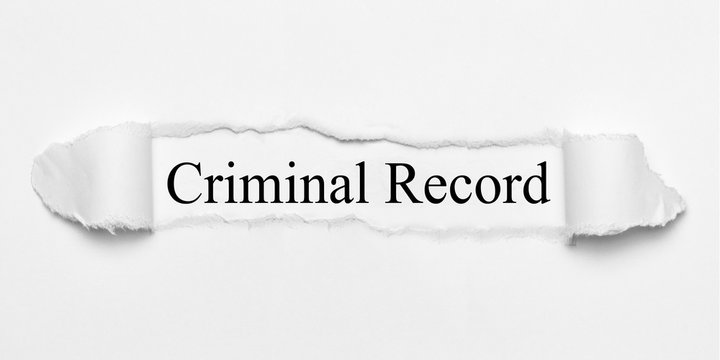 Criminal Record on white torn paper