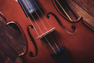 violin on an old wooden background