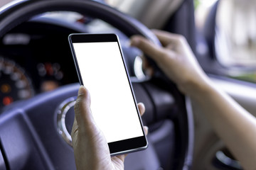 Woman hand use blankscreen mobile phone in car.